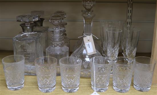 A collection of table glass, including three pairs of decanters, six champagne flutes and six cut-glass tumblers,